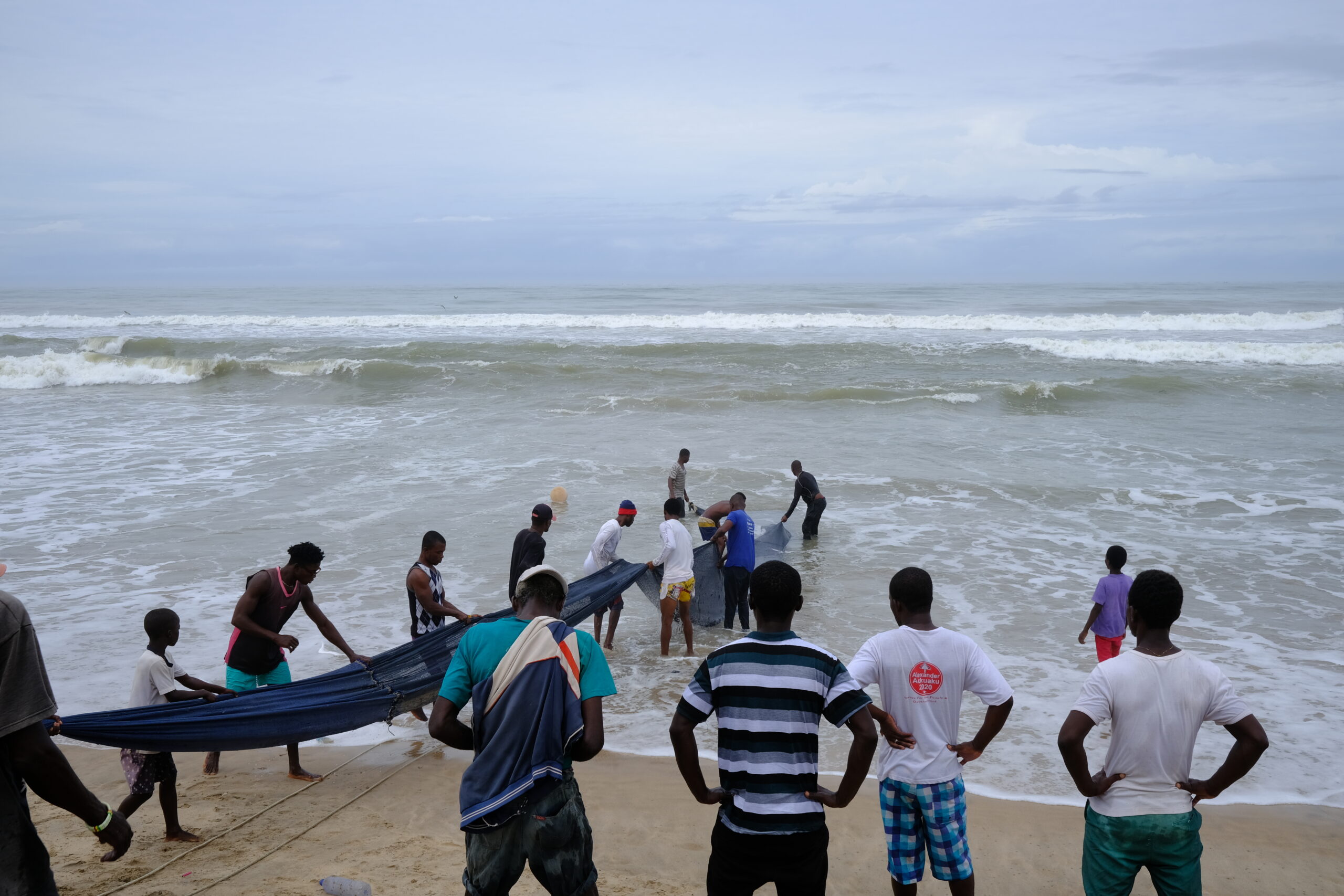 Fishers at Bortianor landing beach in Accra pull their nets to shore, credit: Al-Fattah