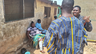 Afua Poma (Maame Turtle) seated on left during the time of her arrest, with two police officers in front. Image credit: Gideon Sarpong, 2024.