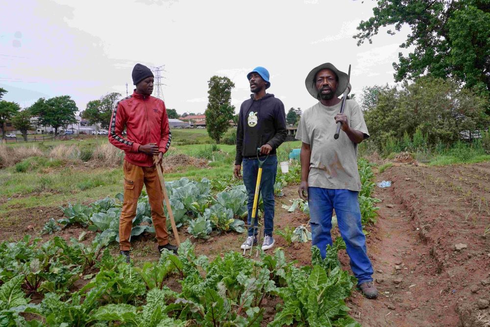 Zethu Hlatshwayo, who is a former artisanal miner, with Given Zulu and Philani Mngomezulu at Khuthala Park in Ermelo, Mpumalanga, South Africa. CREDIT: Oliver Stallwood
