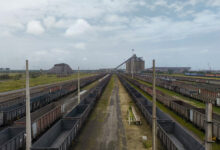Empty coal trucks at Richard’s Bay. CREDIT: Oliver Stallwood